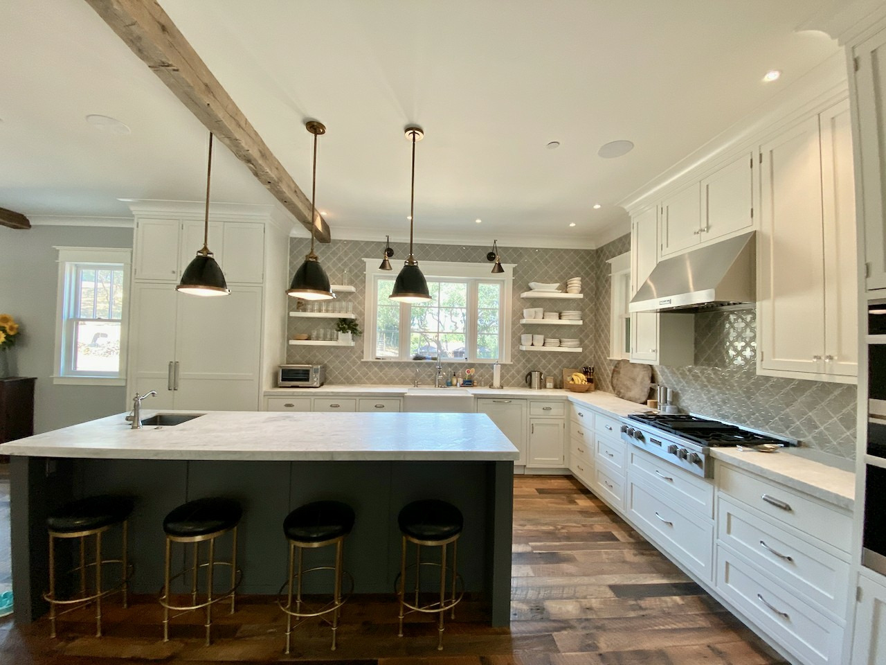 Refinished wine-country kitchen with a deep-green island